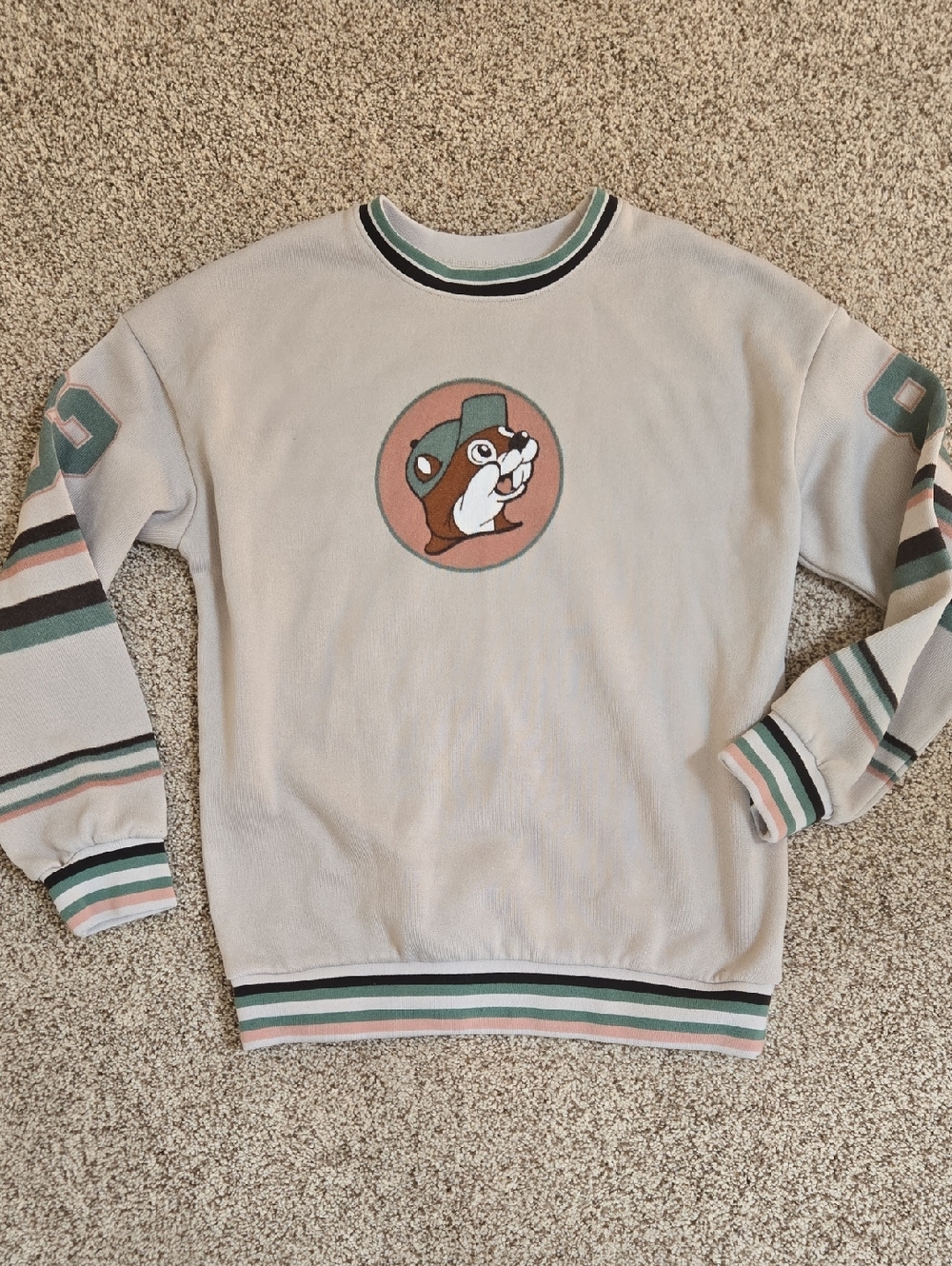 Cream Crewneck Sweater with Mascot Patch and Green & Pink Stripes